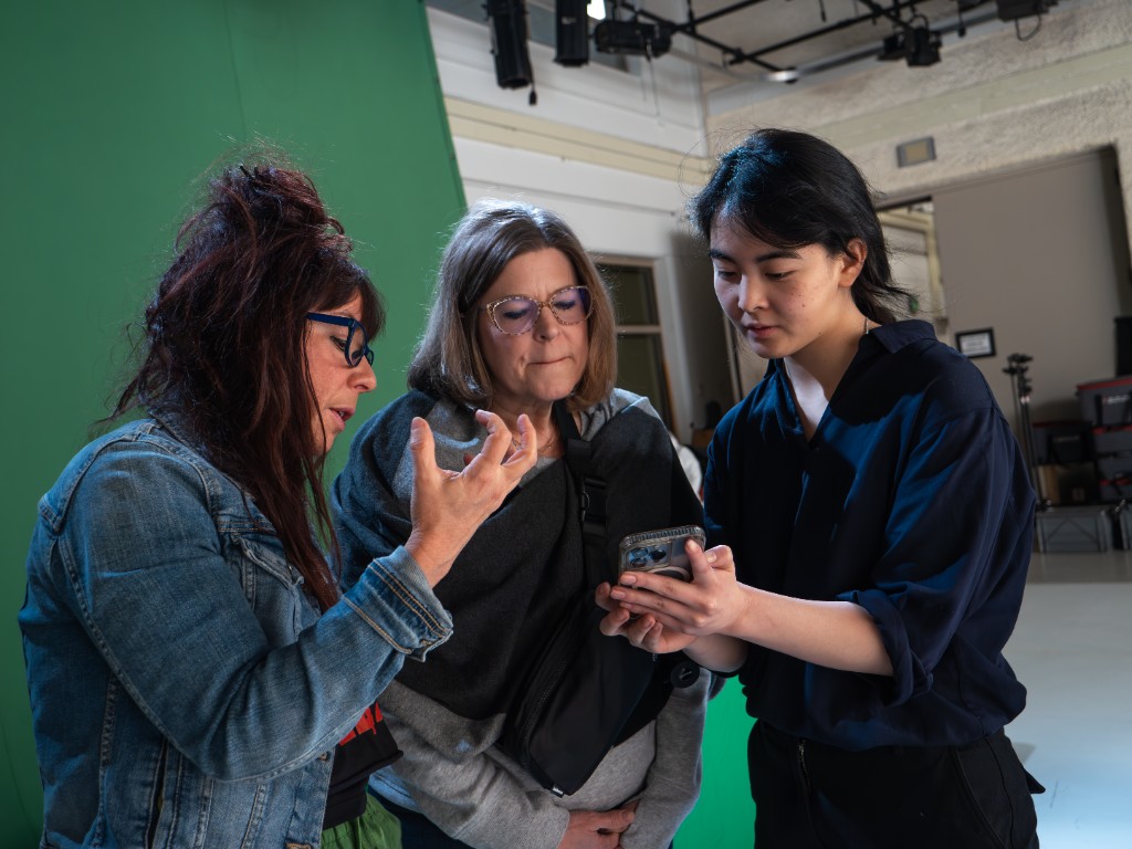 WNBA All-Stars — production crew reviewing footage on set
